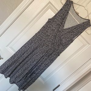 Brand new sleeveless black and white knit fixed wrap style dress